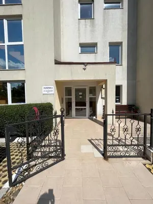 a building with a gate in front of a building at Студио Галерия - Studio Galeria in Byala