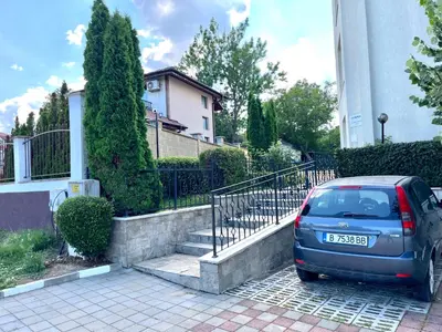 a blue car parked in front of a house at Студио Галерия - Studio Galeria in Byala