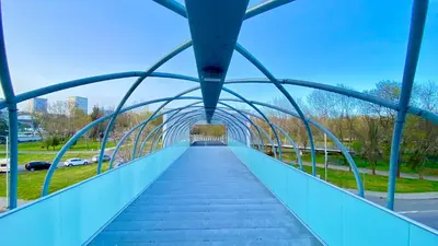 a pedestrian bridge over a road in a city at Arena MALL Galleria View and Securities Parking1 in Burgas City