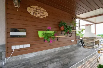 a wooden wall with potted plants on a patio at Sunset Luxury Apartment in Varna City