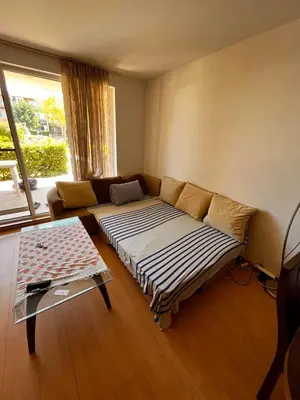 a living room with a couch and a table at Sozopolis Hills - B1 - 3-room apart - 10 min from the beach in Sozopol