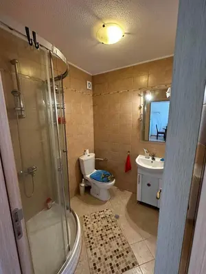 a bathroom with a shower and a toilet and a sink at Sozopolis Hills - B1 - 3-room apart - 10 min from the beach in Sozopol