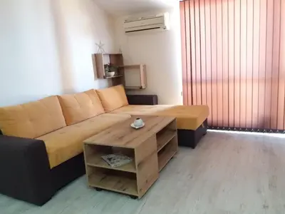 a living room with a couch and a coffee table at Апартамент в комплекс Зора 9A in Sozopol