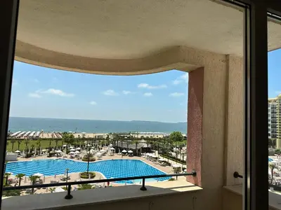 a view of a swimming pool from a window at Sunny Majestic Private Apartment in Sunny Beach