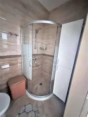a bathroom with a shower and a toilet at Aphrodite Park in Sunny Beach