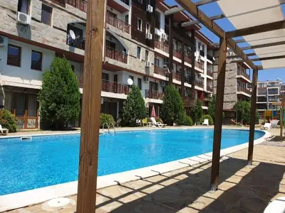 a swimming pool in front of a apartment building at MitProt Panorama Bay 2 Luks studio 155 in Sveti Vlas