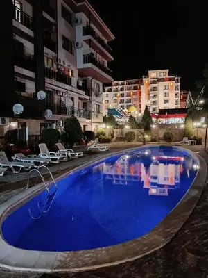 a large blue swimming pool in front of some buildings at MitProt Panorama Bay 2 Luks studio 155 in Sveti Vlas