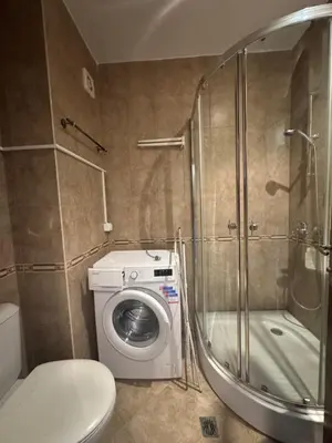 a bathroom with a washing machine and a shower at MitProt Panorama Bay 2 Luks studio 155 in Sveti Vlas