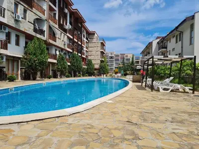 a swimming pool in the middle of a building at MitProt Panorama Bay 2 Luks studio 155 in Sveti Vlas