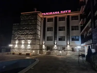 a hotel with a sign on top of it at night at MitProt Panorama Bay 2 Luks studio 155 in Sveti Vlas