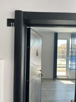 a metal door in a room with a hallway at Zagorovi -1 SP apartments in Burgas City