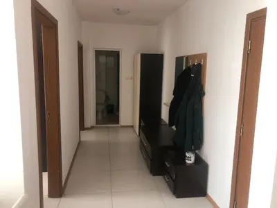 a hallway with a living room with a couch and a mirror at Lovely 3 Room Apartment new furnished Kamelia Sunny Beach in Sunny Beach