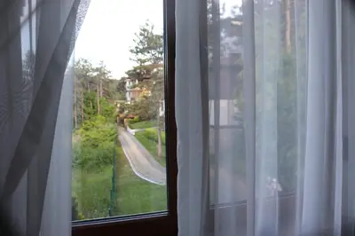 a window with a view of a road from a house at 1 bedroom apartment in Santa Marina Sozopol in Sozopol