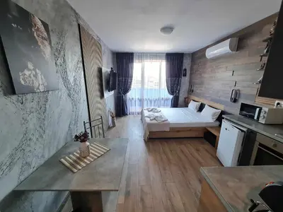 a small room with a bed and a kitchen at MitProt Panorama Bay 2 Studio 206 in Sveti Vlas