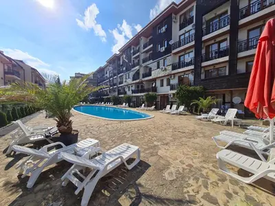 a resort with lounge chairs and a swimming pool at MitProt Panorama Bay 2 Studio 206 in Sveti Vlas