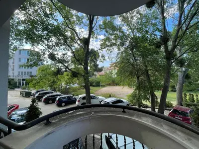 a balcony with cars parked in a parking lot at Harmony Palace - Menada Apatments in Sunny Beach