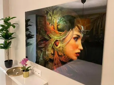 a painting of a woman on a wall at Golden leaf, swimming pool view in Ravda
