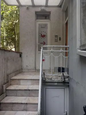 a front door of a house with a gate and stairs at ЛИДЕР ХАУС ХОСТЕЛ in Varna City