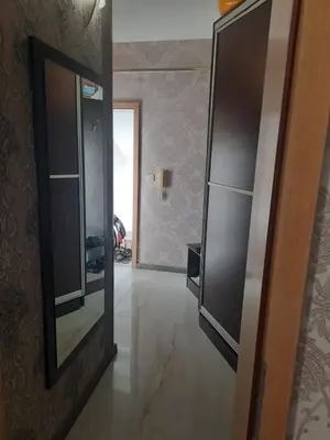 a hallway with a mirror and a door to a room at Apartment with sea view in Sunny Beach