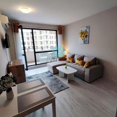 a living room with a couch and a table at U Dacha - Premium Apartments in Sunny Beach