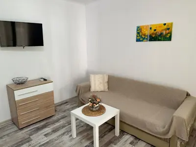 a living room with a couch and a table at Villa Sea House 2 in Byala