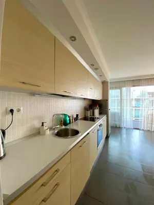 a kitchen with a sink and a counter top at Sea view Penthouse (YooBulgaria) in Obzor