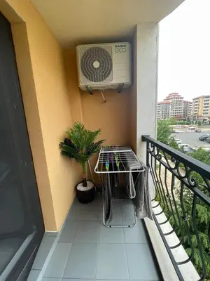 a balcony with a fan and a plant at Villa Astoria 5. Sveti Vlas k.k. Elenite in Sveti Vlas