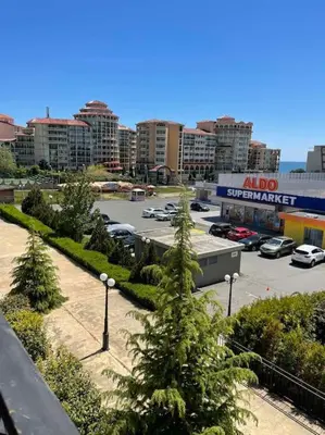 a parking lot with cars parked in a parking lot at Villa Astoria 5. Sveti Vlas k.k. Elenite in Sveti Vlas