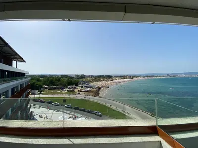 a view of the beach from the balcony of a building at PARADISO 'В' 609 Studio Nessebar Private in Nesebar