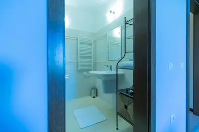 a white bathroom with a sink and a toilet at Luxury 2 bedroom villa in Sozopolis in Sozopol
