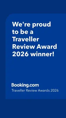 a blue sign that says were proud to be a traveller reviewagency winner at Guest Rooms Skalite in Sozopol