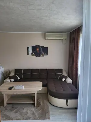 a living room with a couch and a table at VIP Аpartament in Sunny Beach