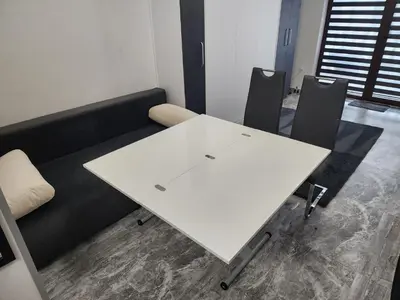 a white table and chairs in a room at VALENCIA GARDENS STUDIO LUX 4 per. in Nesebar