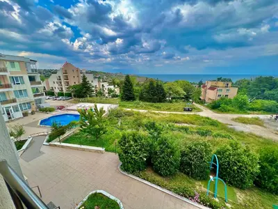 a view of a yard with a pool and buildings at SOLITA Apartment with Panoramic View in Byala