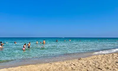 a group of people in the water at the beach at SOLITA Apartment with Panoramic View in Byala