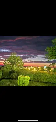 a view of a park at night with trees and lights at Sun Houses Novo Oriahovo in Novo Oryakhovo
