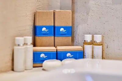 a group of bottles of essential oils sitting on a shelf at Hotel Fara - Marina Cape in Aheloy