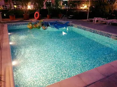 a swimming pool with a toy in the middle of it at Family Hotel Eliri in Nesebar