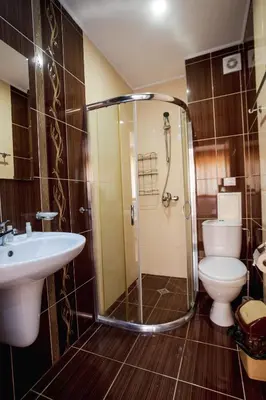 a bathroom with a shower and a toilet and a sink at K&E studios and apartments - All inclusive - Free parking in Sunny Beach