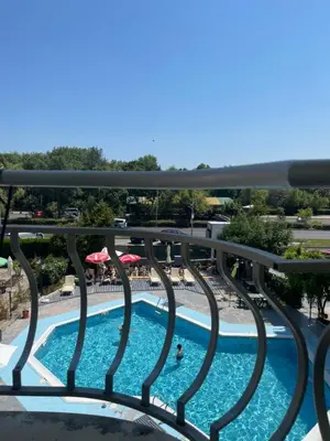 a view of a swimming pool from a balcony at Апартамент Бриз 16 in Sunny Beach