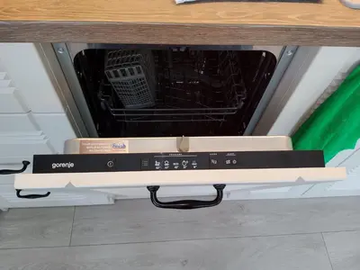 a dishwasher in a kitchen with its door open at апартамент Релакс in Varna City