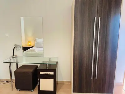 a desk and a mirror in a room at Комплекс Бриз / Breeze Complex Apartments in Sunny Beach