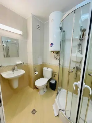 a bathroom with a toilet and a sink and a shower at Комплекс Бриз / Breeze Complex Apartments in Sunny Beach