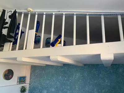 a bunch of snowboards are sitting on a rail at Seaview Holiday - Черноморска почивка in Aheloy
