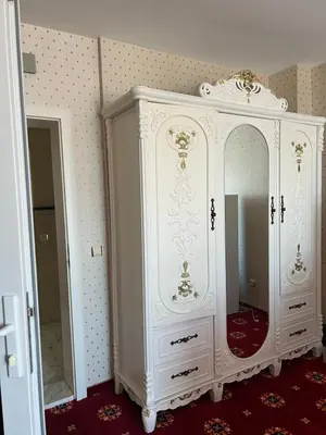 a white cabinet with a mirror in a room at Hotel Amore Beach - All Inclusive in Elenite