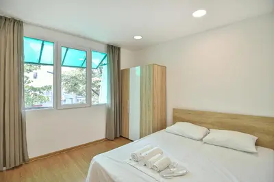 a bedroom with a bed with two towels on it at Hideout in heart of Varna with WiFi in Varna City