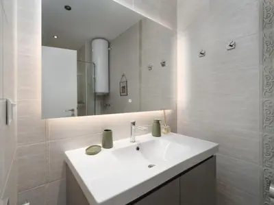 a white bathroom with a sink and a mirror at Smokinia Sunrise - Kavatsi Beach, Sozopol in Sozopol