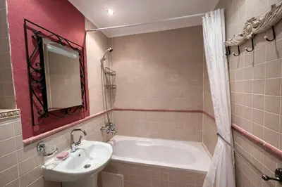 a bathroom with a sink and a bath tub at Royal Bay-I Seaview Apartment in Sveti Vlas