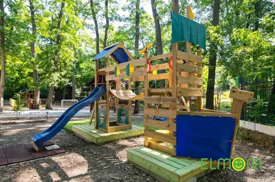 a playground with a slide in a park at Elmona Villas in Kamchia