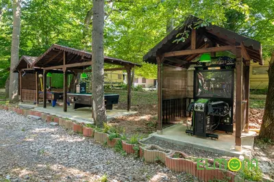 a gazebo with a ping pong table in it at Elmona Villas in Kamchia